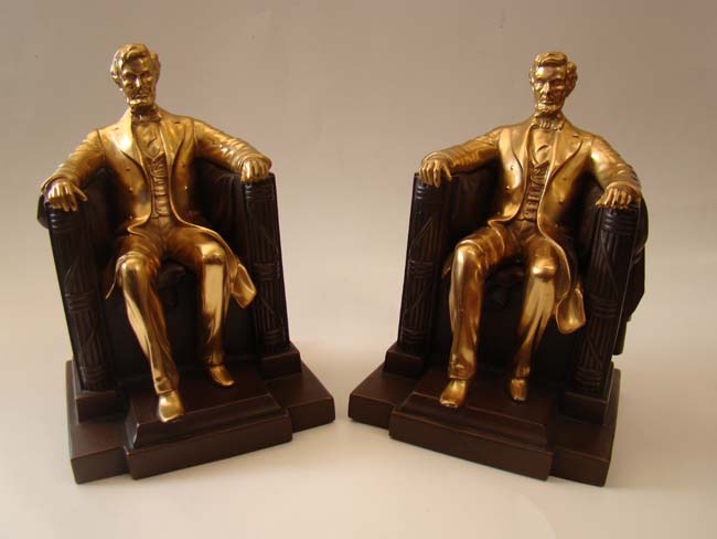 A FABULOUS pair of "Lincoln in the chair" bookends by Jennings Brothers circa 1930